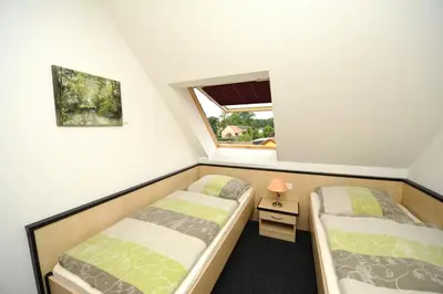 Ein Bett oder Betten in einem Zimmer der Unterkunft Ferienappartements Am Spreewaldfliess