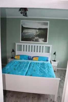 Ein Bett oder Betten in einem Zimmer der Unterkunft Ferienwohnung Am See 55