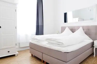 Ein Bett oder Betten in einem Zimmer der Unterkunft SC 03 by ROCKCHAIR Apartments l SUPERHOST Status l 2 Bedrooms Boxspringbeds Balcony Elevator - Cozy Family & Business Flair welcomes you!