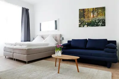 Ein Sitzbereich in der Unterkunft BLISSE by ROCKCHAIR Apartments l SUPERHOST Status l 5 Schlafzimmer 3 Bäder 3 Balkone l Family & Business Flair welcomes you!