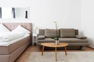 Ein Sitzbereich in der Unterkunft BLISSE by ROCKCHAIR Apartments l SUPERHOST Status l 5 Schlafzimmer 3 Bäder 3 Balkone l Family & Business Flair welcomes you!