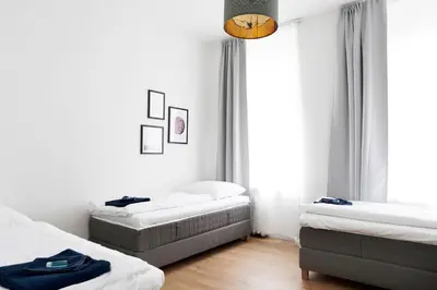 Ein Bett oder Betten in einem Zimmer der Unterkunft GREIF by ROCKCHAIR Apartments l SUPERHOST Status l 2 Bedrooms Boxspringbeds in City Center - Cozy Family & Business Flair welcomes you!