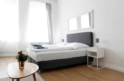 Ein Bett oder Betten in einem Zimmer der Unterkunft GREIF by ROCKCHAIR Apartments l SUPERHOST Status l 2 Bedrooms Boxspringbeds in City Center - Cozy Family & Business Flair welcomes you!