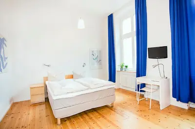 Ein Bett oder Betten in einem Zimmer der Unterkunft Pension Peters – Das andere Hotel