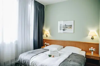 Ein Bett oder Betten in einem Zimmer der Unterkunft Hotel 