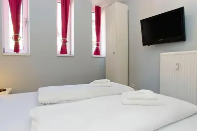 Ein Bett oder Betten in einem Zimmer der Unterkunft Apartmenthouse Berlin - Am Görlitzer Park