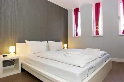 Ein Bett oder Betten in einem Zimmer der Unterkunft Apartmenthouse Berlin - Am Görlitzer Park