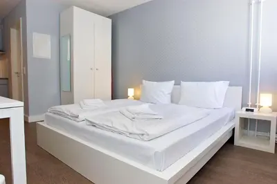 Ein Bett oder Betten in einem Zimmer der Unterkunft Apartmenthouse Berlin - Am Görlitzer Park