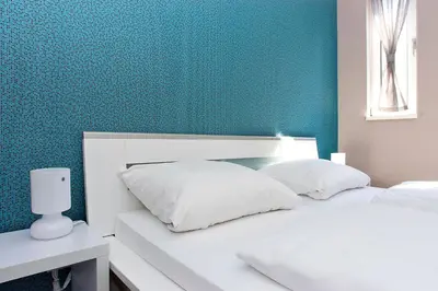 Ein Bett oder Betten in einem Zimmer der Unterkunft Apartmenthouse Berlin - Am Görlitzer Park