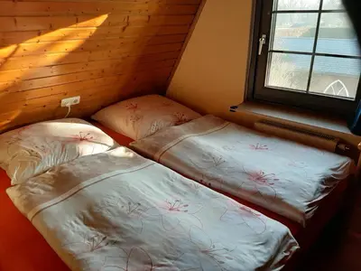 Ein Bett oder Betten in einem Zimmer der Unterkunft Ferienhaus Kerstin