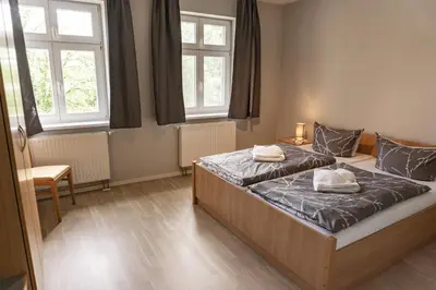 Ein Bett oder Betten in einem Zimmer der Unterkunft Apartmenthaus am Grienericksee