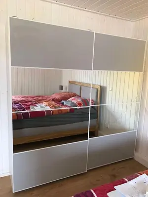 Ein Bett oder Betten in einem Zimmer der Unterkunft Skandinavisches Ferienhaus 2. Reihe zum Wasser für 6 Personen
