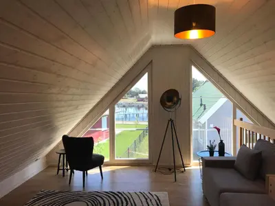 Ein Sitzbereich in der Unterkunft Skandinavisches Ferienhaus 2. Reihe zum Wasser für 6 Personen