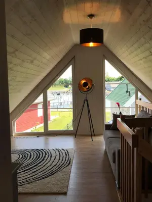 Ein Bett oder Betten in einem Zimmer der Unterkunft Skandinavisches Ferienhaus 2. Reihe zum Wasser für 6 Personen