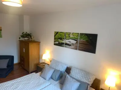 Ein Bett oder Betten in einem Zimmer der Unterkunft Altstadt Ferienwohnung