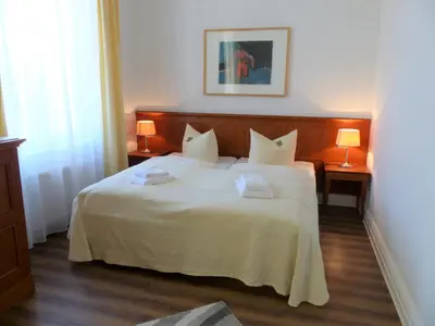 Ein Bett oder Betten in einem Zimmer der Unterkunft Hotel Vierseithof Luckenwalde