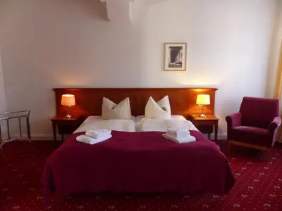 Ein Bett oder Betten in einem Zimmer der Unterkunft Hotel Vierseithof Luckenwalde