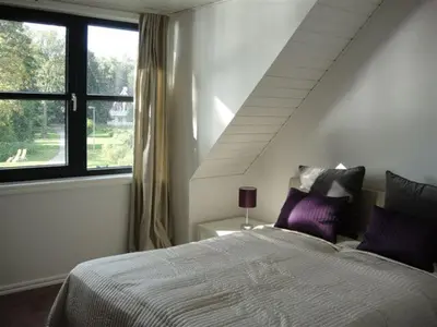 Ein Bett oder Betten in einem Zimmer der Unterkunft Schlosspark Bad Saarow