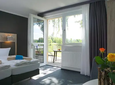 Ein Bett oder Betten in einem Zimmer der Unterkunft Boootshaus - Am Spreeufer