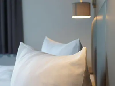 Ein Bett oder Betten in einem Zimmer der Unterkunft Boootshaus - Am Spreeufer