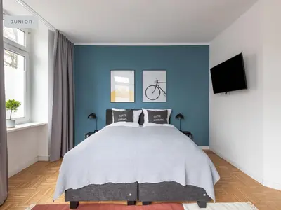 Ein Bett oder Betten in einem Zimmer der Unterkunft Apartments Berlin Aroser Allee