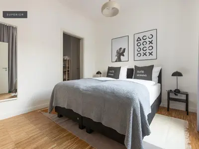 Ein Bett oder Betten in einem Zimmer der Unterkunft Apartments Berlin Aroser Allee