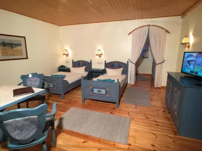 Ein Bett oder Betten in einem Zimmer der Unterkunft Hotel & Restaurant Zur Spreewälderin