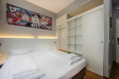 Ein Bett oder Betten in einem Zimmer der Unterkunft mk hotel berlin