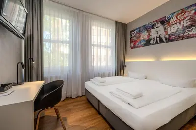 Ein Bett oder Betten in einem Zimmer der Unterkunft mk hotel berlin