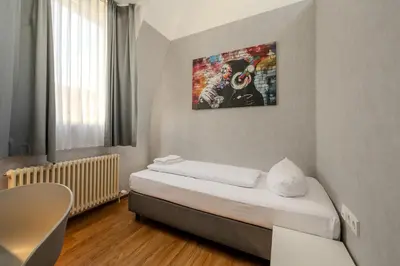 Ein Bett oder Betten in einem Zimmer der Unterkunft mk hotel berlin