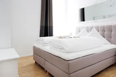 Ein Bett oder Betten in einem Zimmer der Unterkunft SC 01 by ROCKCHAIR Apartments l SUPERHOST Status l 2 Bedrooms Boxspringbeds Balcony Elevator - Cozy Family & Business Flair welcomes you!