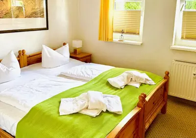 Ein Bett oder Betten in einem Zimmer der Unterkunft Villa Kurpark Bad Saarow