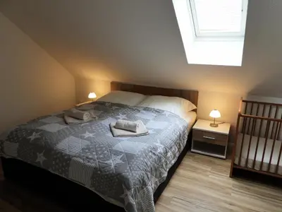 Ein Bett oder Betten in einem Zimmer der Unterkunft Auf der Heide - Ferienhaus für 6 Personen