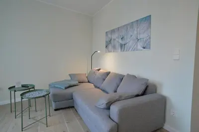 Ein Sitzbereich in der Unterkunft Grey House Apartments Grossbeeren