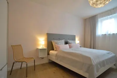 Ein Bett oder Betten in einem Zimmer der Unterkunft Grey House Apartments Grossbeeren