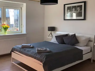 Ein Bett oder Betten in einem Zimmer der Unterkunft Landlust Hotel