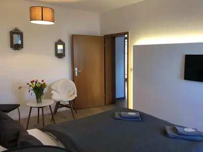 Ein Bett oder Betten in einem Zimmer der Unterkunft Landlust Hotel