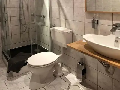 Ein Badezimmer in der Unterkunft Landlust Hotel