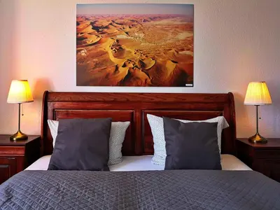 Ein Bett oder Betten in einem Zimmer der Unterkunft Landlust Hotel
