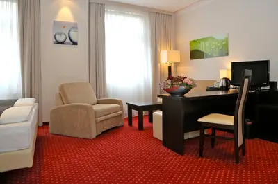 Ein Sitzbereich in der Unterkunft Hotel Herbst Berlin