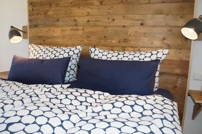 Ein Bett oder Betten in einem Zimmer der Unterkunft BluGarden Ferienapartments im Spreewald