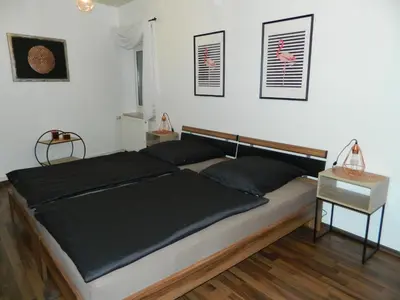 Ein Bett oder Betten in einem Zimmer der Unterkunft Unter den Linden