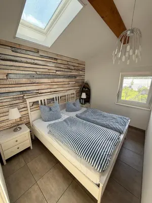 Ein Bett oder Betten in einem Zimmer der Unterkunft Ferien am See