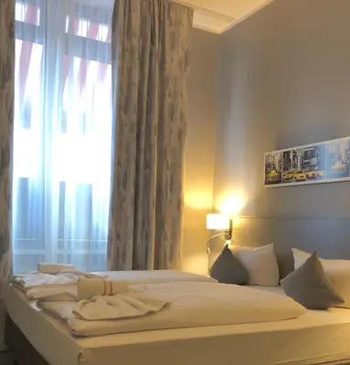 Ein Bett oder Betten in einem Zimmer der Unterkunft Hotel Arena Inn - Berlin Mitte