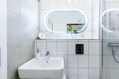 Ein Badezimmer in der Unterkunft DR APARTMENTS
