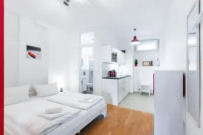 Ein Bett oder Betten in einem Zimmer der Unterkunft DR APARTMENTS