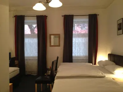 Ein Bett oder Betten in einem Zimmer der Unterkunft Hotel-Pension Dorma