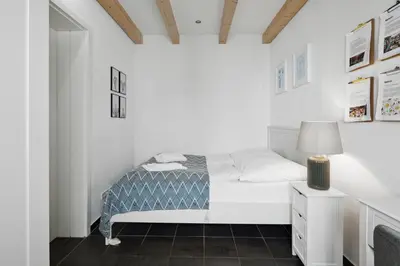Ein Bett oder Betten in einem Zimmer der Unterkunft Arbio I Urban Apartment