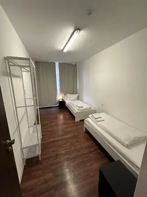 Ein Bett oder Betten in einem Zimmer der Unterkunft Potsdamer Inn