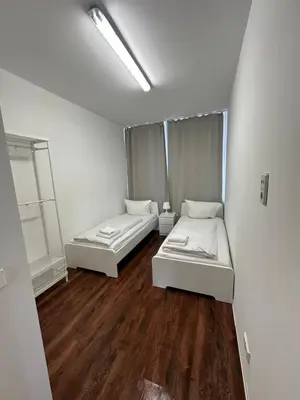Ein Bett oder Betten in einem Zimmer der Unterkunft Potsdamer Inn